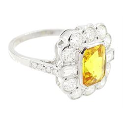 Platinum yellow sapphire and diamond milgrain set cluster ring, single octagonal cut sapphire of approx 2.20 carat, surrounded by two baguette cut diamonds and ten transitional cut diamonds and diamond set shoulders, stamped Plat, total diamond weight approx 0.95 carat