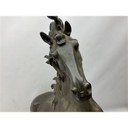Large bronzed composite model of a rearing horse, upon a circular stepped base, H64.5cm