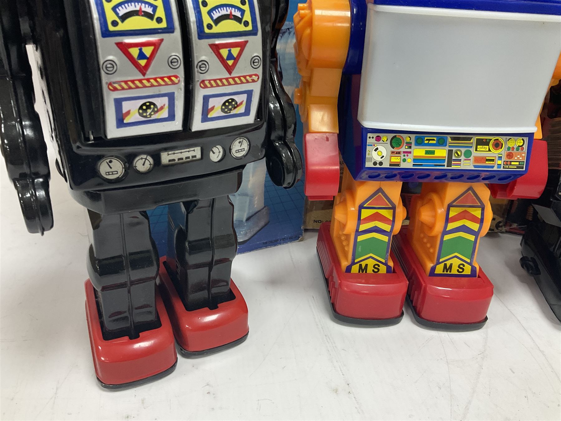 Three vintage battery operated robots comprising tin-plate Space Walk Man ME 100 Robot, Saturn the 13