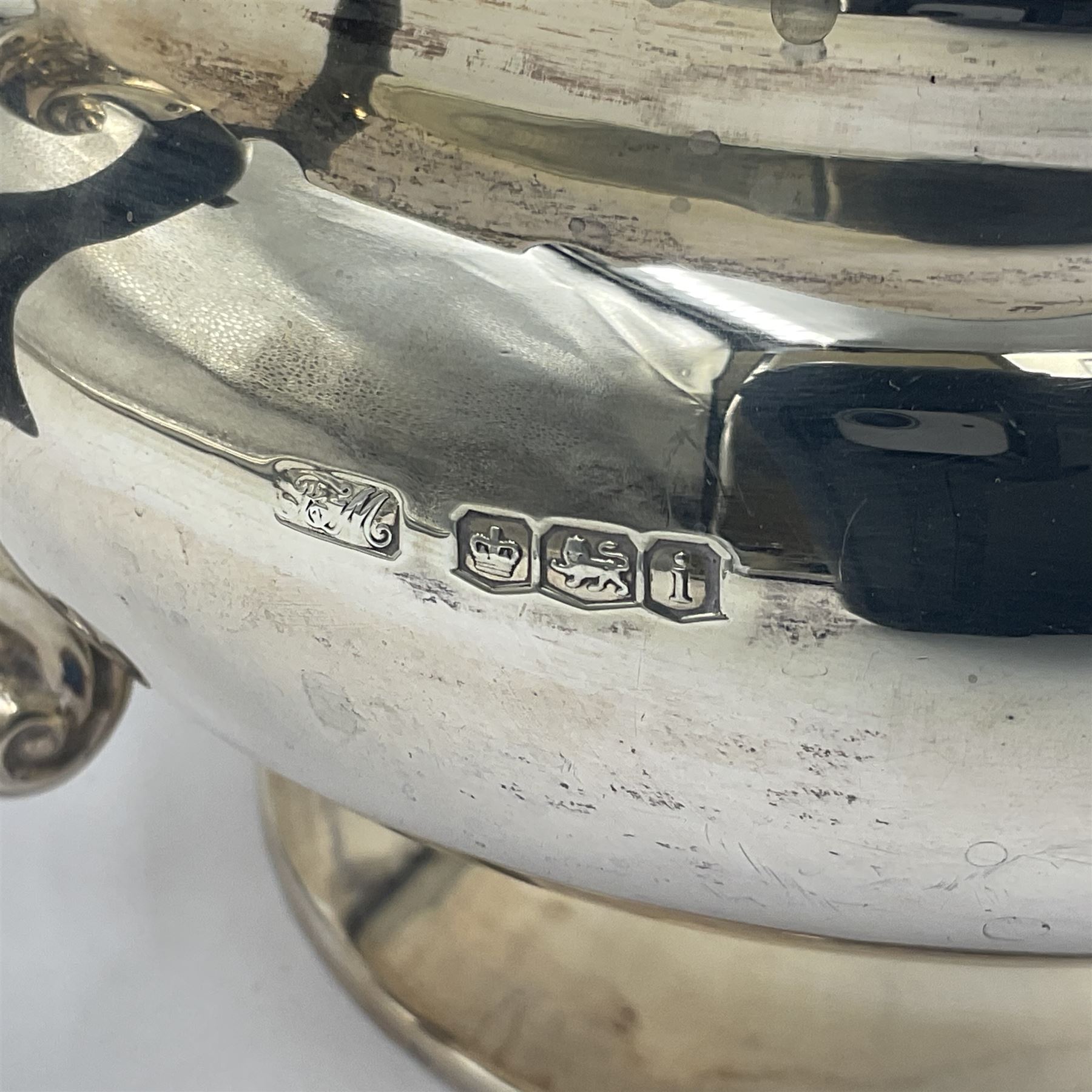 1920s five-piece silver tea service, comprising teapot, coffee pot, hot water pot, twin handled open sucrier and milk jug, each of squat circular form with shaped rim, the teapot, coffee pot and hot water pot each with ebonised handle and finial, the sucrier and milk jug with acanthus capped scroll handles, all upon circular foot, hallmarked R F Mosley & Co, Sheffield 1926 & 1927, tallest H24cm