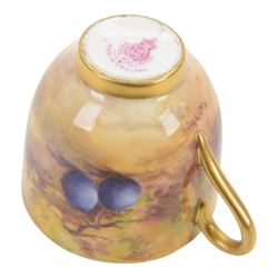 Two Royal Worcester fruit painted miniature cabinet cups and saucers, the first example interior hand painted with apples and blackberries upon a mossy ground, the cup exterior and centre of saucer gilded, cup signed W. Hale and saucer signed G. Mosley, each with puce coloured printed marks beneath, the second example, exterior hand painted with pears and blackberries upon a mossy ground, the cup interior and centre of saucer gilded, cup signed Rushton and saucer signed W. H. Austin, each with puce coloured printed marks beneath, largest H6cm