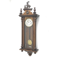 Late 19th century Vienna type wall clock in walnut case,  figural pediment above glazed door with half turned pilasters, single weight driven movement stamped '159964', H132cm