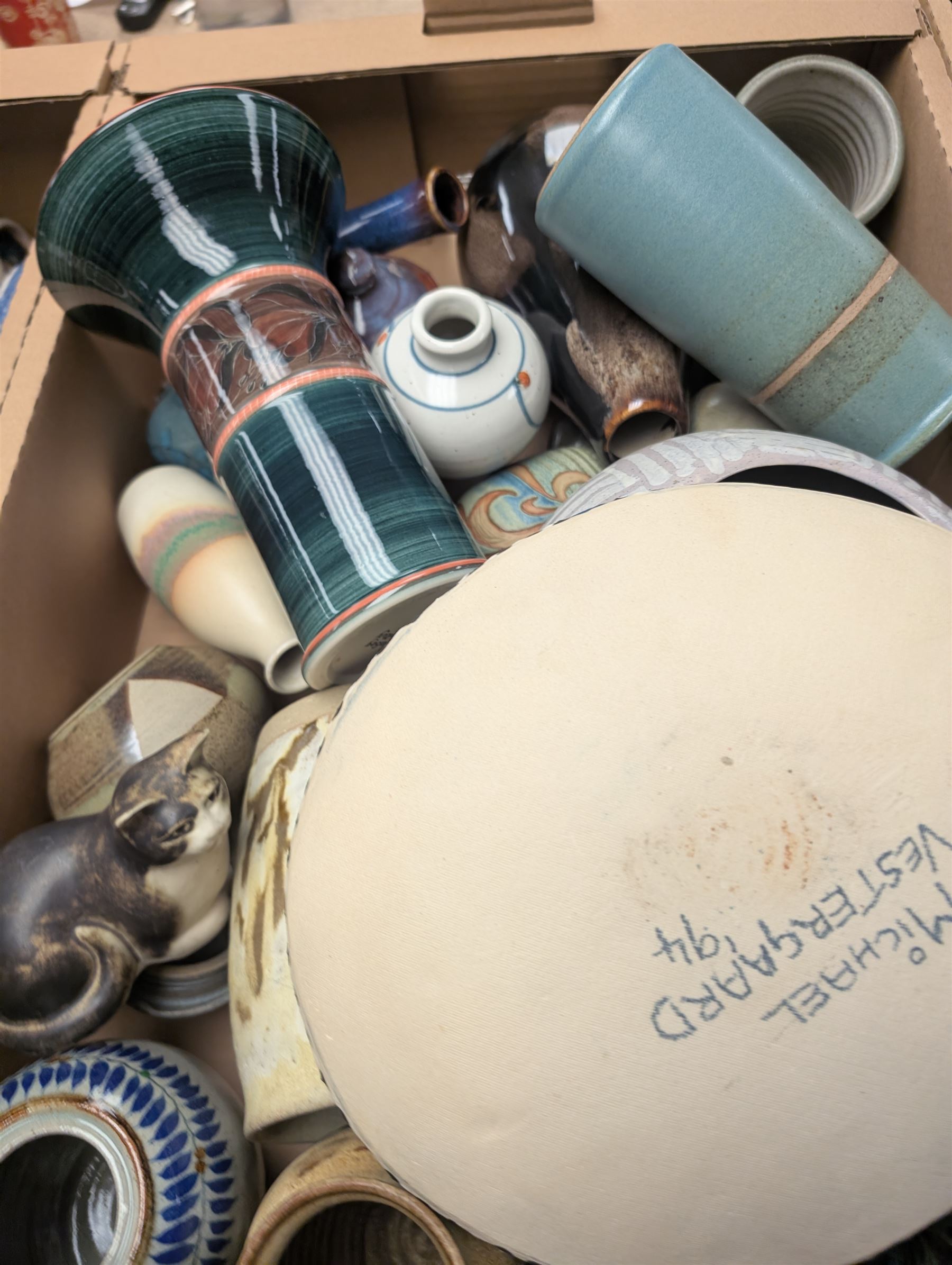 Collection of studio pottery, including bowls, vases, goblets and bottles, in four boxes 