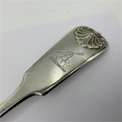 Victorian Newcastle silver Fiddle Shell pattern serving spoon, the terminal engraved with crest of a fist holding an arrow aloft, hallmarked Lister & Sons, Newcastle 1862, L31cm