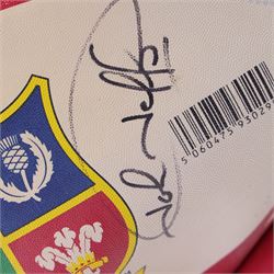 Three signed rugby balls, including 2017 Lions Tour Rhino Jumbo ball, signed by eight players, including Greig Laidlaw, Rugby world cup 2003 example and a 2001 British Lions example
