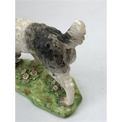 Two 19th century Staffordshire models of hunting dogs, each stood upon naturalistically modelled bases, tallest H12cm, longest L15cm