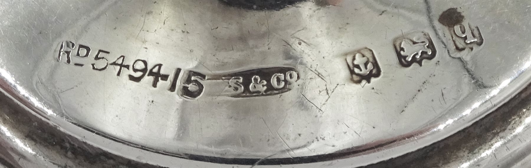 Edwardian silver three branch epergne by Cohen & Charles, Birmingham 1909 and two other silver specimen vases by Sydney & Co, Birmingham 1915