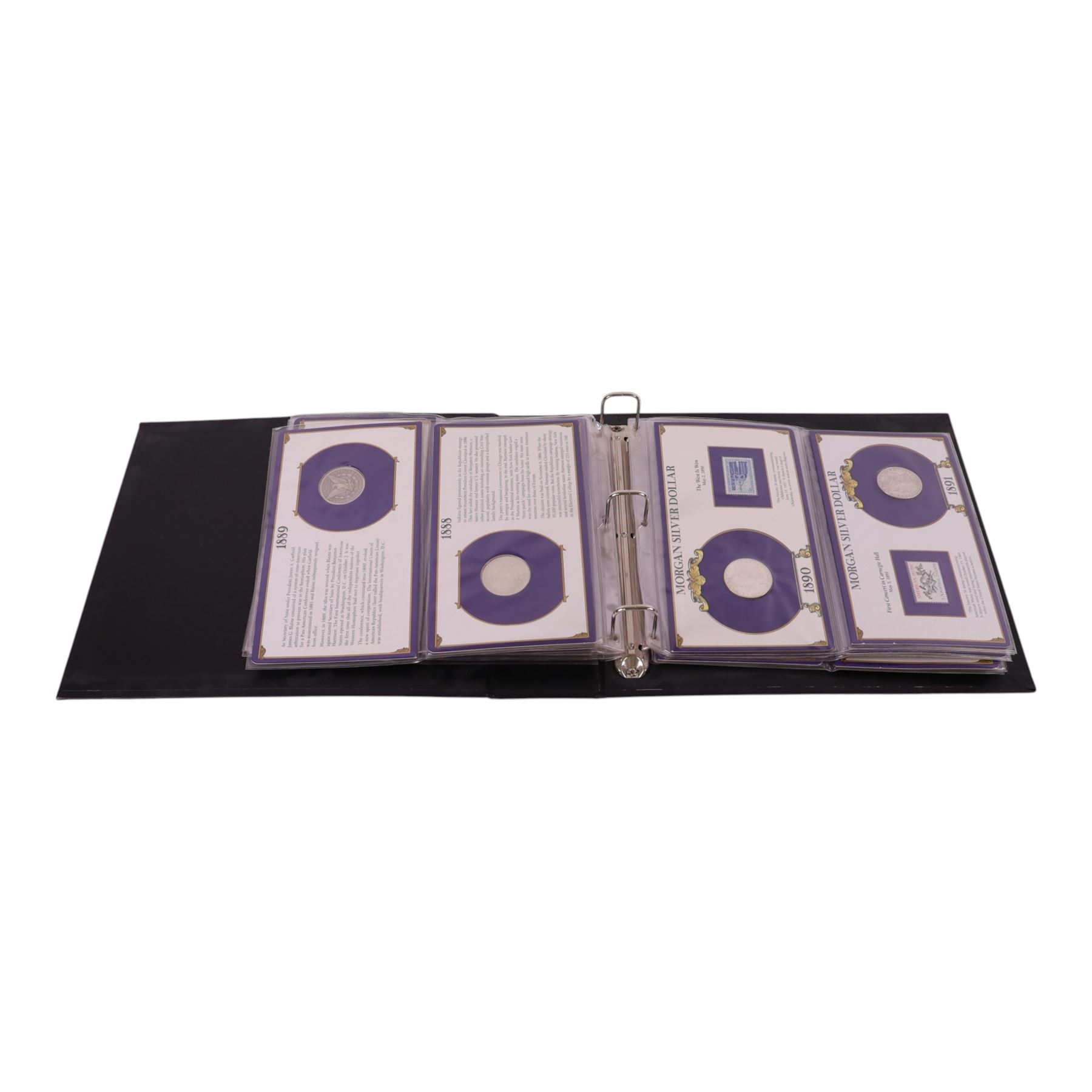 Twenty-five United States of America silver one dollar coins, comprising eighteen 'Morgan' and seven 'Peace' dollars, in 'The U.S. Silver Dollar Collection' ring binder