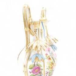Large mid 19th century French porcelain vase, of baluster form with raised twin handles with applied stylised flower heads, the body painted with panels of pronounced floral sprays within blue and gilt borders, H58cm