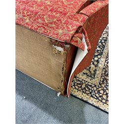 Large Knole design hardwood-framed three-seat drop-arm sofa, upholstered in crimson fabric decorated with trailing acanthus leaves and shields, together with scatter cushions 