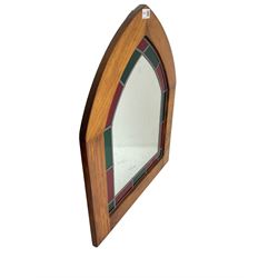 Beech framed arched wall mirror, green and red stained glass slip