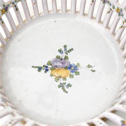 Two 20th century French faience openwork baskets, by Emile Tessier Malicorne, painted with polychromatic floral decoration, with scalloped rims, marked to base, larger 9cm (2)