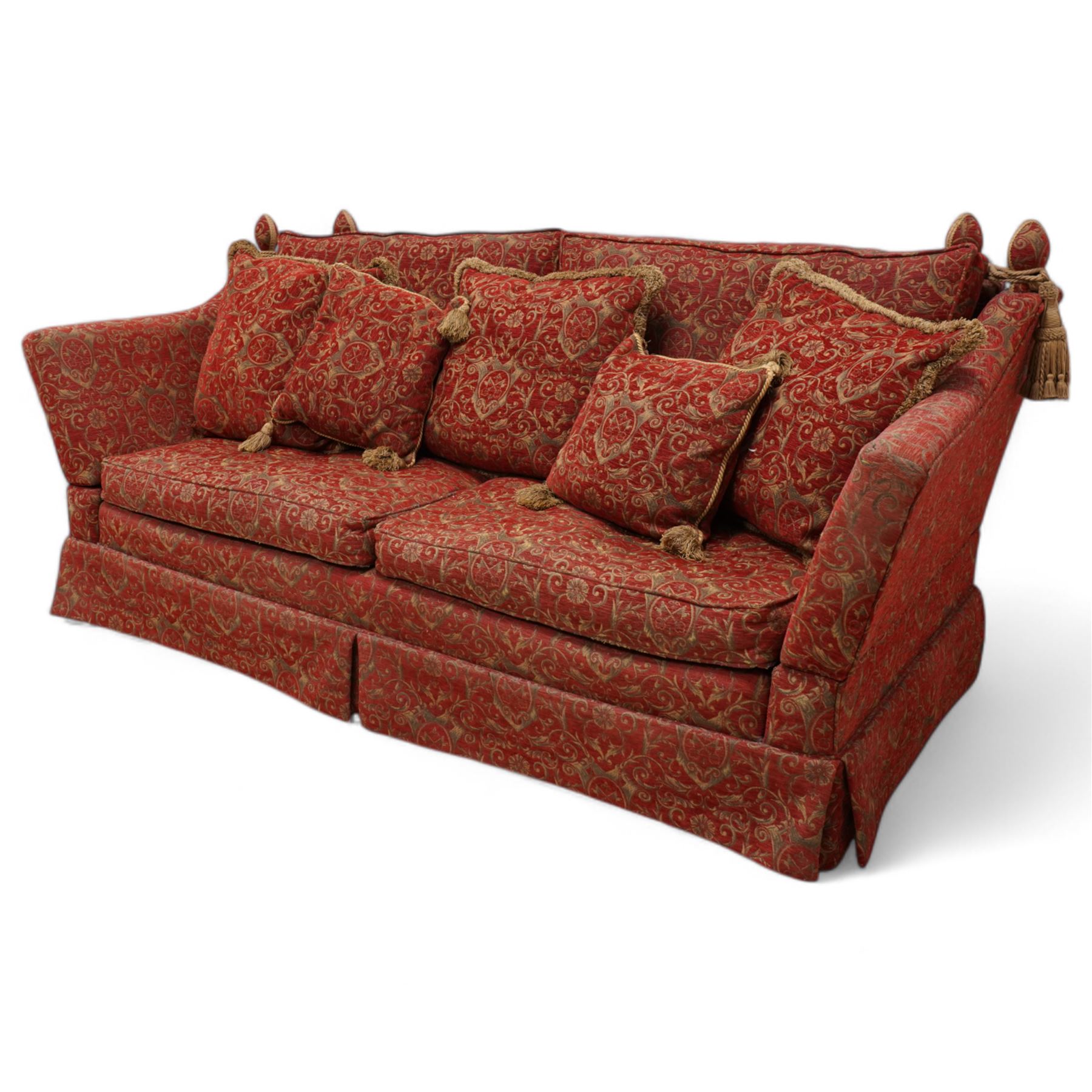 Large Knole design hardwood-framed three-seat drop-arm sofa, upholstered in crimson fabric decorated with trailing acanthus leaves and shields, together with scatter cushions 