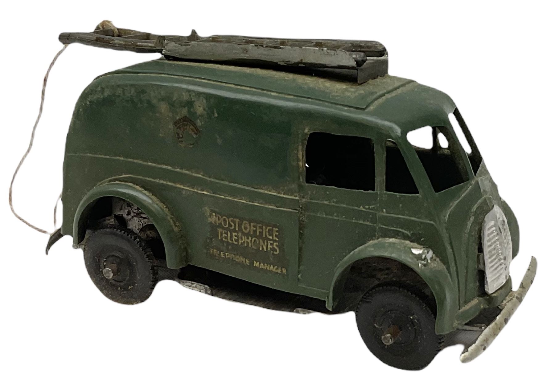 Eight Tri-ang Minic tin-plate/plastic clockwork vehicles comprising Tipper Lorry, Post Office Telephones Van, Caterpillar Tractor, Evening News Van, two Royal Mail Vans, American jeep and saloon car; all unboxed (8)
