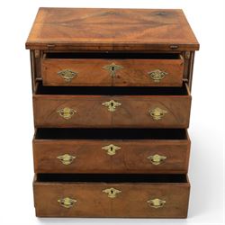 Early 20th century Georgian design figured walnut bachelor's chest, with half fold over top and lopers, over three drawers with pierced brass handles and escutcheons 