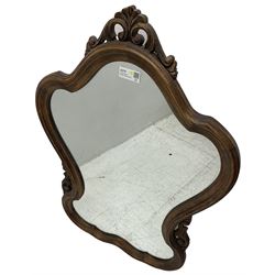 French design stained beech framed wall mirror, shaped and moulded framed with scrolling foliage carved pediment and brackets, plain mirror plate 