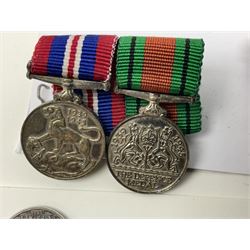 Eleven medal miniatures including Turkish Crimea, OBE (Civil), WW2 Burma Star and France/Germany Star, two pairs of WW2 War/Defence medals, LSGC etc; and two military badges