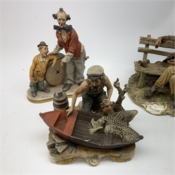 A group of four Capodimonte figurines, comprising The Fisherman, Tramp on Bench, each with accompanying certificate, and two others, one modelled as two clowns leaning against a broken drum, the other modelled as a painter.