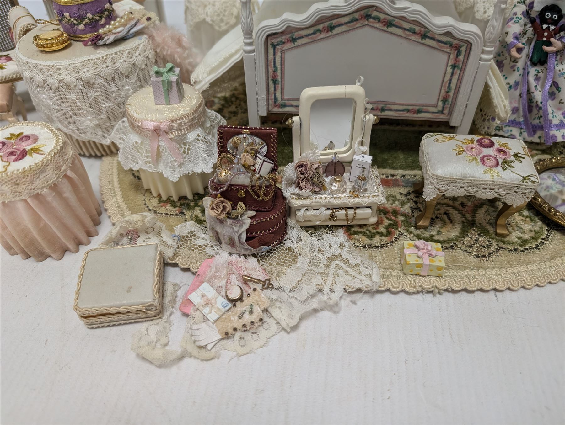 Dolls house bedroom and dressing room furniture, including beds, wardrobe, dressing table, lamps, tables, two figures and a collection of accessories