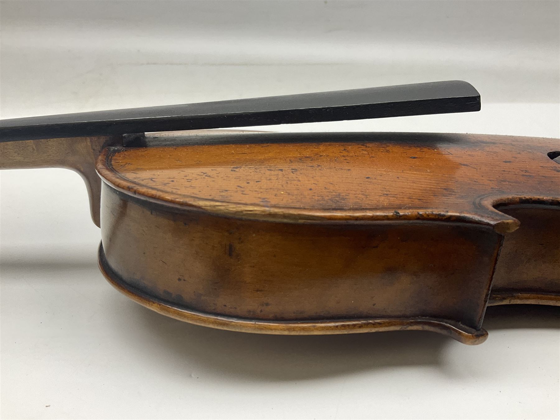 Late 19th century German trade violin c1890 with 36cm two-piece birds-eye maple back, neck and ribs and spruce top; bears label 'Manufactured in Berlin Special Copy of Nicolaus Amati' L59.5cm; in carrying case