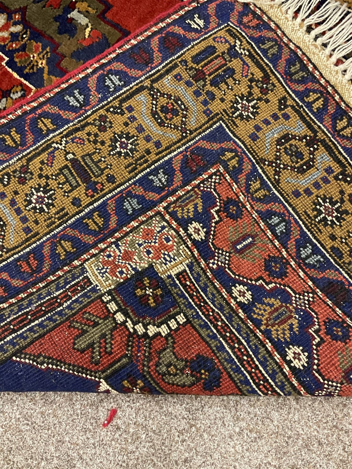 Turkish Taspinar rug, blue ground with central lozenge and medallion, the outer borders decorated with stylised motifs