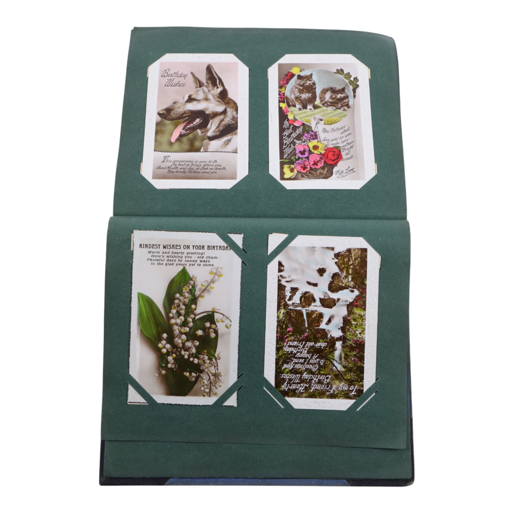 Collection of early 20th century postcards and greetings cards, including WWI embroidered silk Christmas card, black and white family photographs, 1920s birthday cards, black and white and colour postcards of Margate, Ramsgate, Blackpool etc, housed in three postcard albums