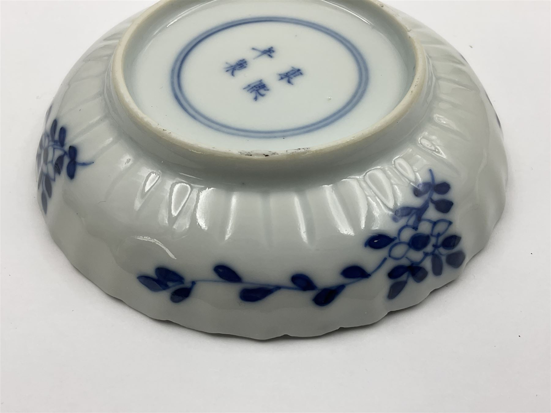 18th century Chinese blue and white Kangxi teacup and saucer, decorated with dancing figures, four character Kangxi mark beneath, saucer D10cm