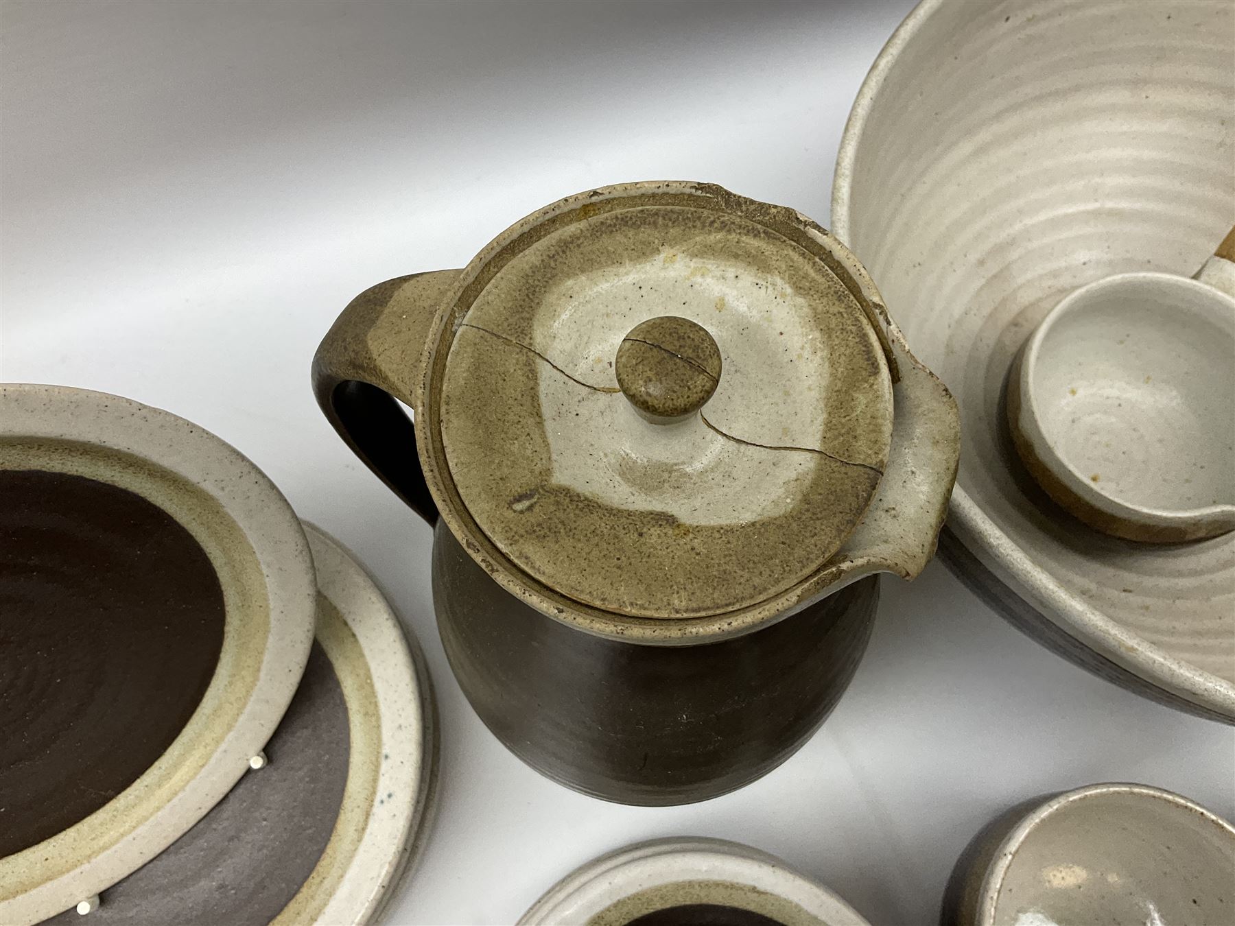 Marianne De Trey (British 1913-2016) stoneware coffee service for twelve, together with a large deep stoneware footed bowl and ladle with wood handle, all decorated in Manganese 'Pattern 1' with impressed shell marks, bowl D27cm