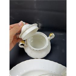Royal Albert Val D'or part tea and dinner service, including two coffee pots, two teapots, milk jug, covered sucrier etc together with matching items 