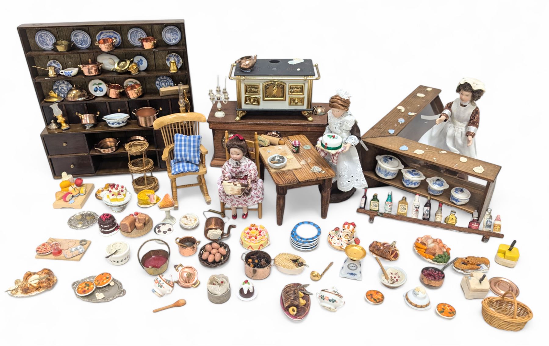 Victorian and later style dolls house kitchen furniture, including countertop, dresser displaying copper pots and blue and white ceramics, baking table, oven, three figures and a collection of food and baking accessories