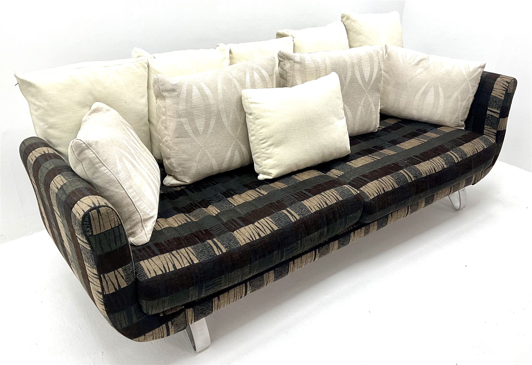 Grande four seat sofa upholstered in patterned fabric with contrasting scatter cushions 