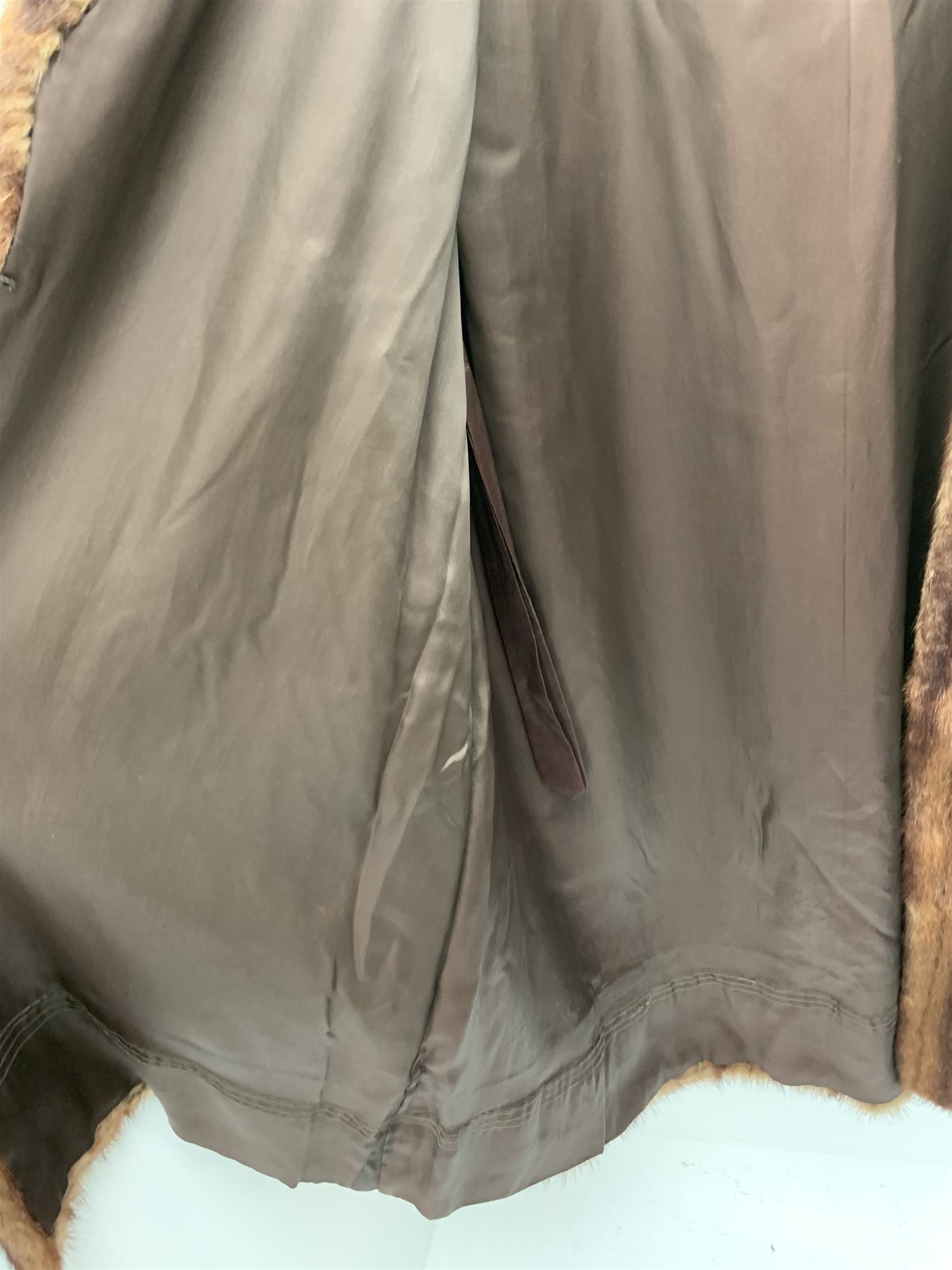 A lined Musquash fur coat. 