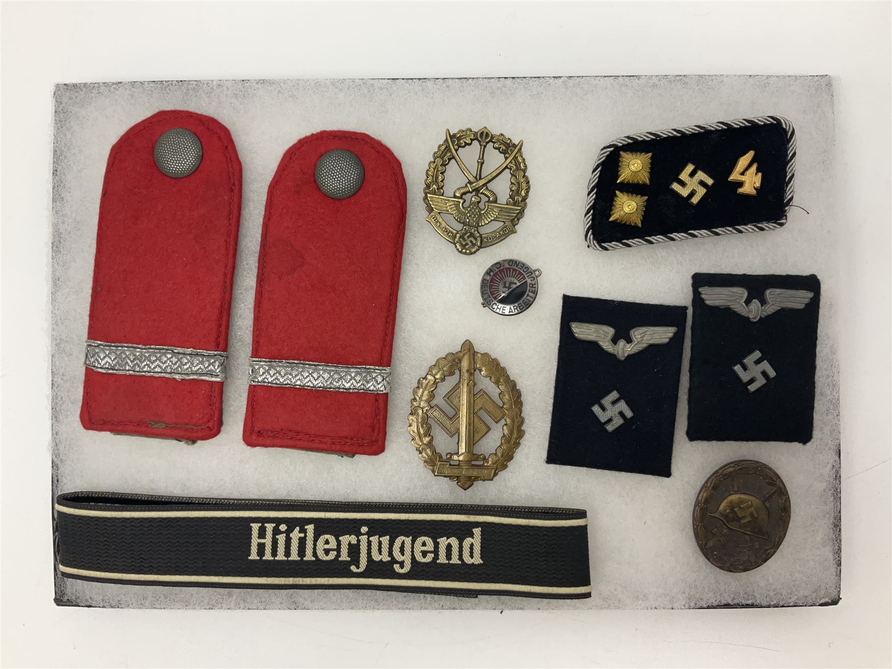 WW2 German Don Cossack epaulettes; and quantity of German insignia including SA Sports Badge for war wounded, Hitler Youth badge, Young Cossacks badge, Wound badge, Hitler Youth cuff title etc; in glass topped display box.
