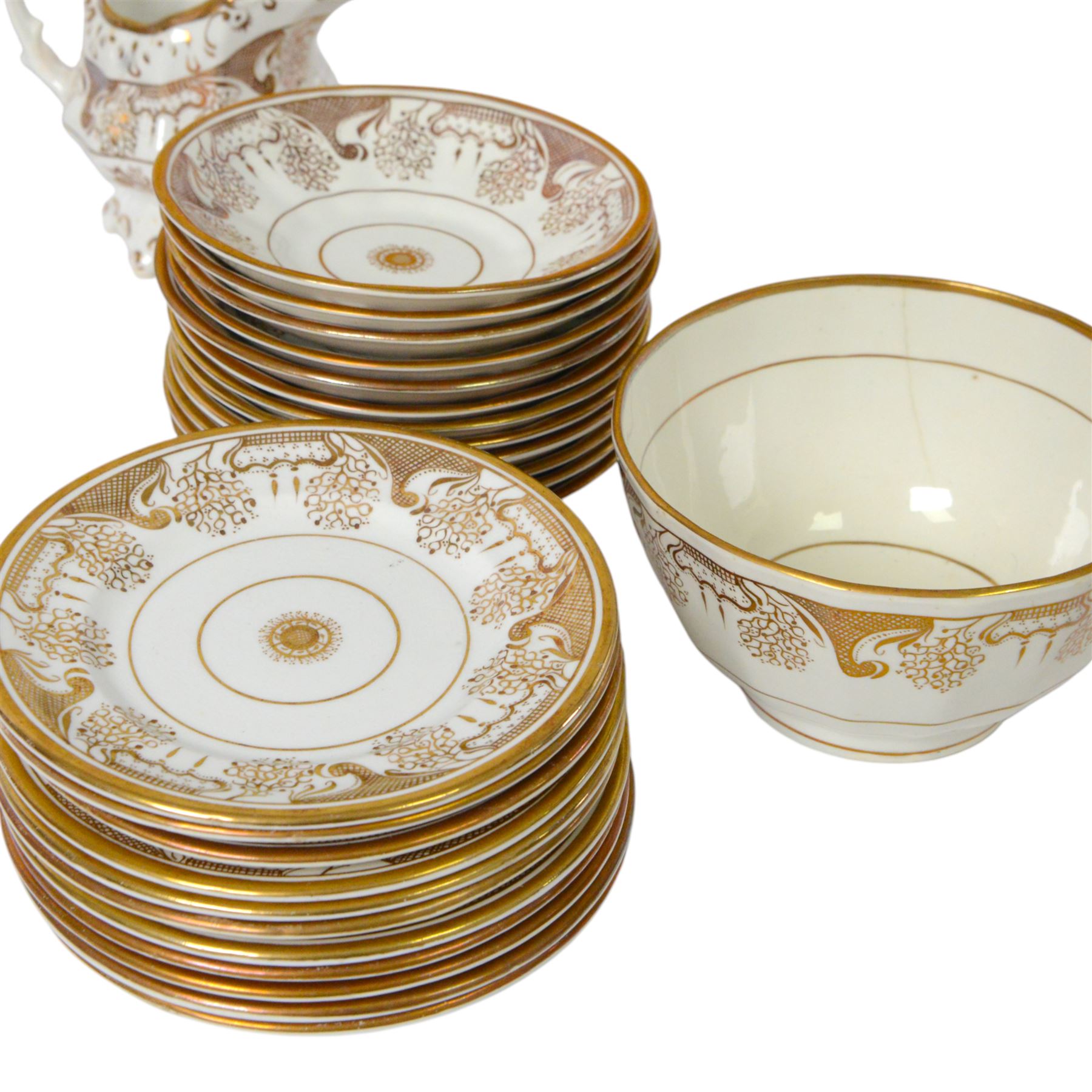 Late 19th century tea service, decorated in gilt with bands of seaweed type tendrils, thistles and cross hatch reserves upon a white glazed ground, comprising tea pot, twin handle lidded sucrier, milk jug, slop bowl, three serving plates, twelve cups and saucers and eleven side plates