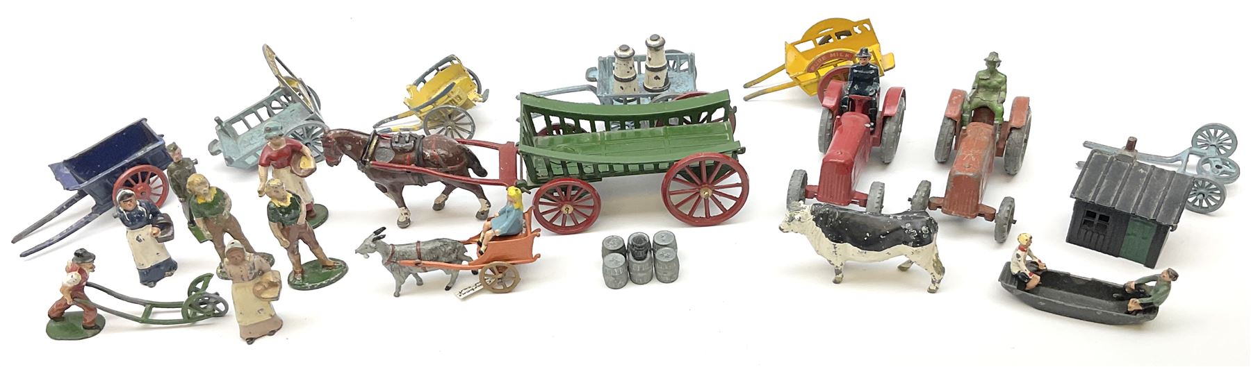 Lead figures - pre-war Charbens goat cart with girl; Timpo ploughman; Timpo cow; Salco Dray Carts; see-saw boat with boy and girl; two Charbens tractors; Taylor & Barrett governess cart; six Wendal figures etc