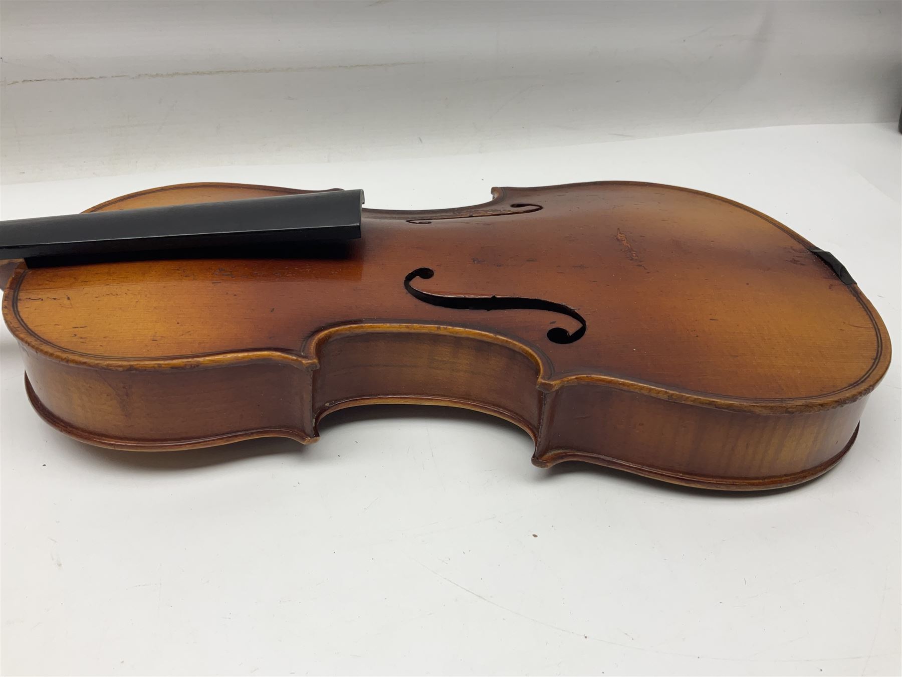 Saxony (?) violin c1950 with 36cm two-piece maple back and ribs and spruce top; bears label 'The Maidstone School Orchestra Association' L59cm overall; and 1950s Czechoslovakian violin for restoration; both in carrying cases (2)