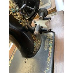 Two vintage sewing machines, the first marked Federation, in mahogany case, the second marked Singer, in oak case. 