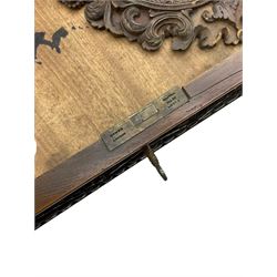 19th century Anglo-Indian teak/camphor twin pedestal desk, raised back fitted with pierced and foliate carved panelled sliding doors, enclosing pigeonholes and correspondence drawers, rectangular top with ebonised banding and moulded edge over a lunette carved frieze, fitted with nine drawers, decorated with carved and pierced mounts