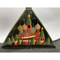 Russian balalaika with six-piece segmented back, the top painted with a scene of Russian onion capped buildings monogrammed K.B.H.1993; bears cyrillic label; L67.5cm; in carrying bag