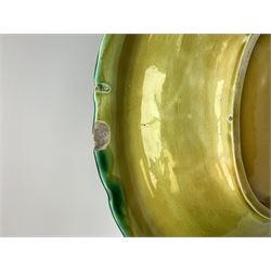 A Victorian majolica bread plate depicting corn within a woven basket, L33cm, together with a Victorian majolica jug modelled in the form of a corn cob, with registration mark beneath, H22cm. 