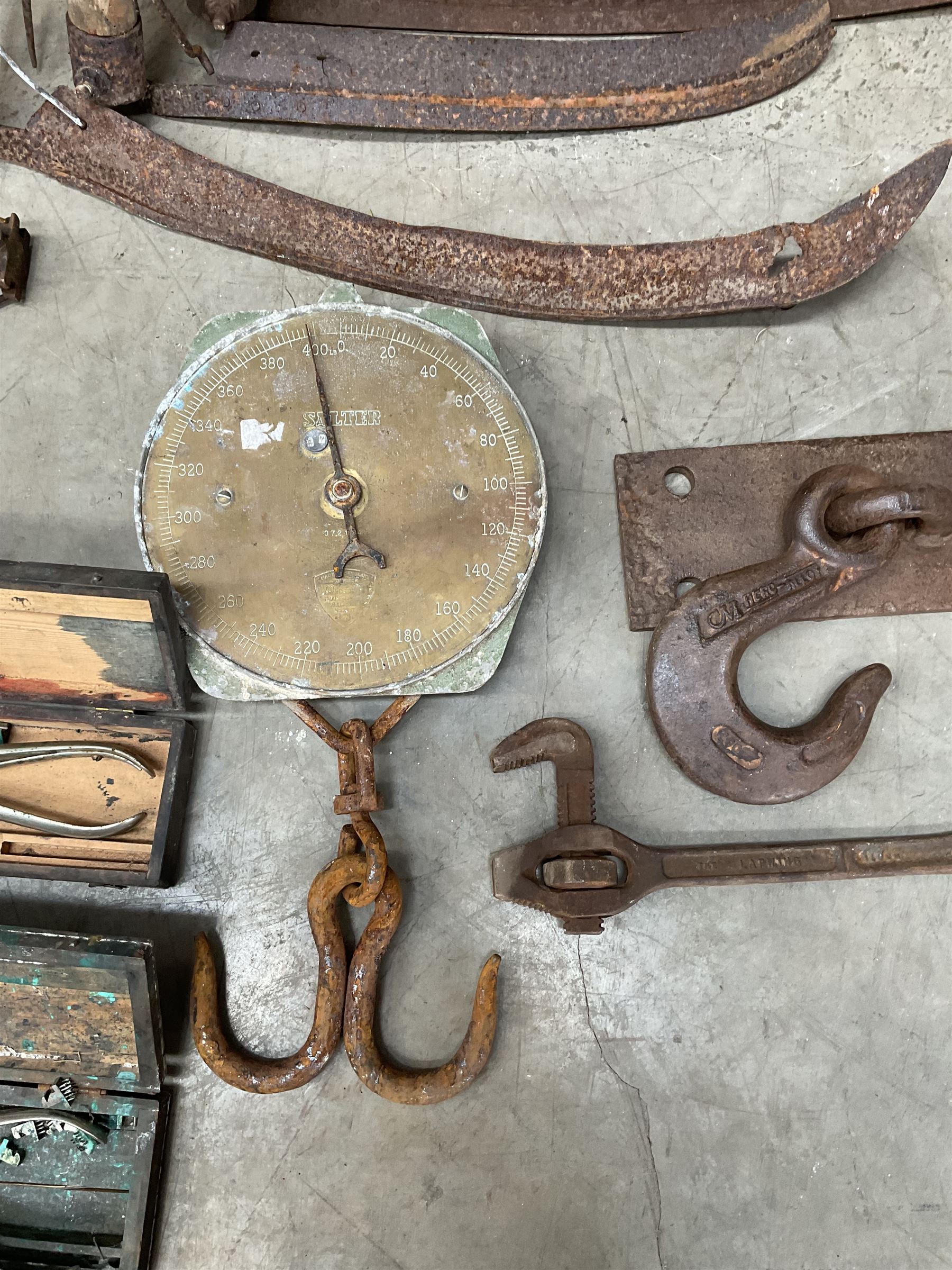Large quantity of vintage hand tools including scales, scythes, saws etc