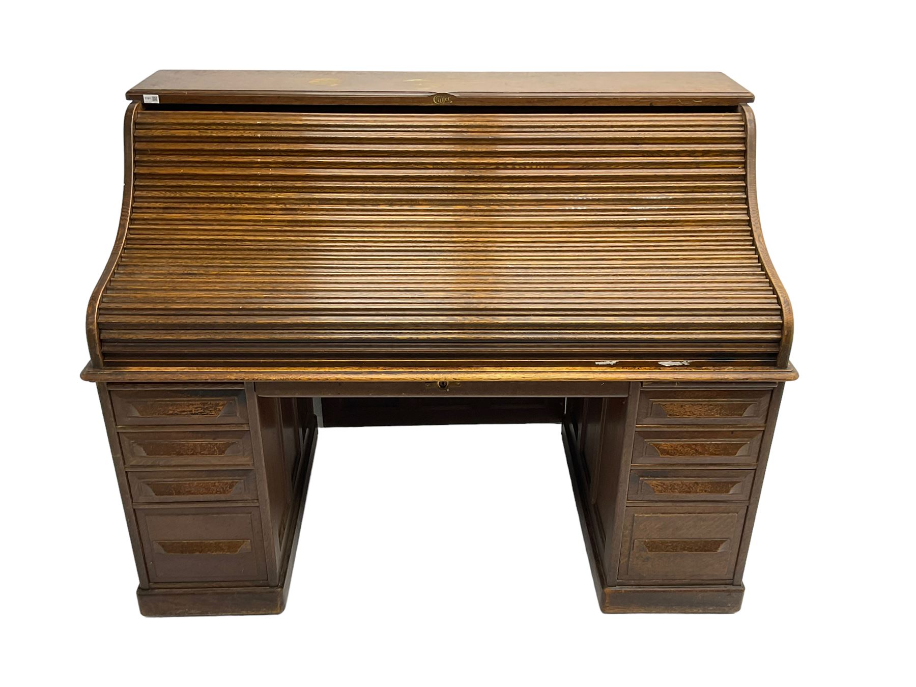 Cutler - early 20th century American oak tambour roll-top desk, the twin pedestals fitted with four graduating drawers