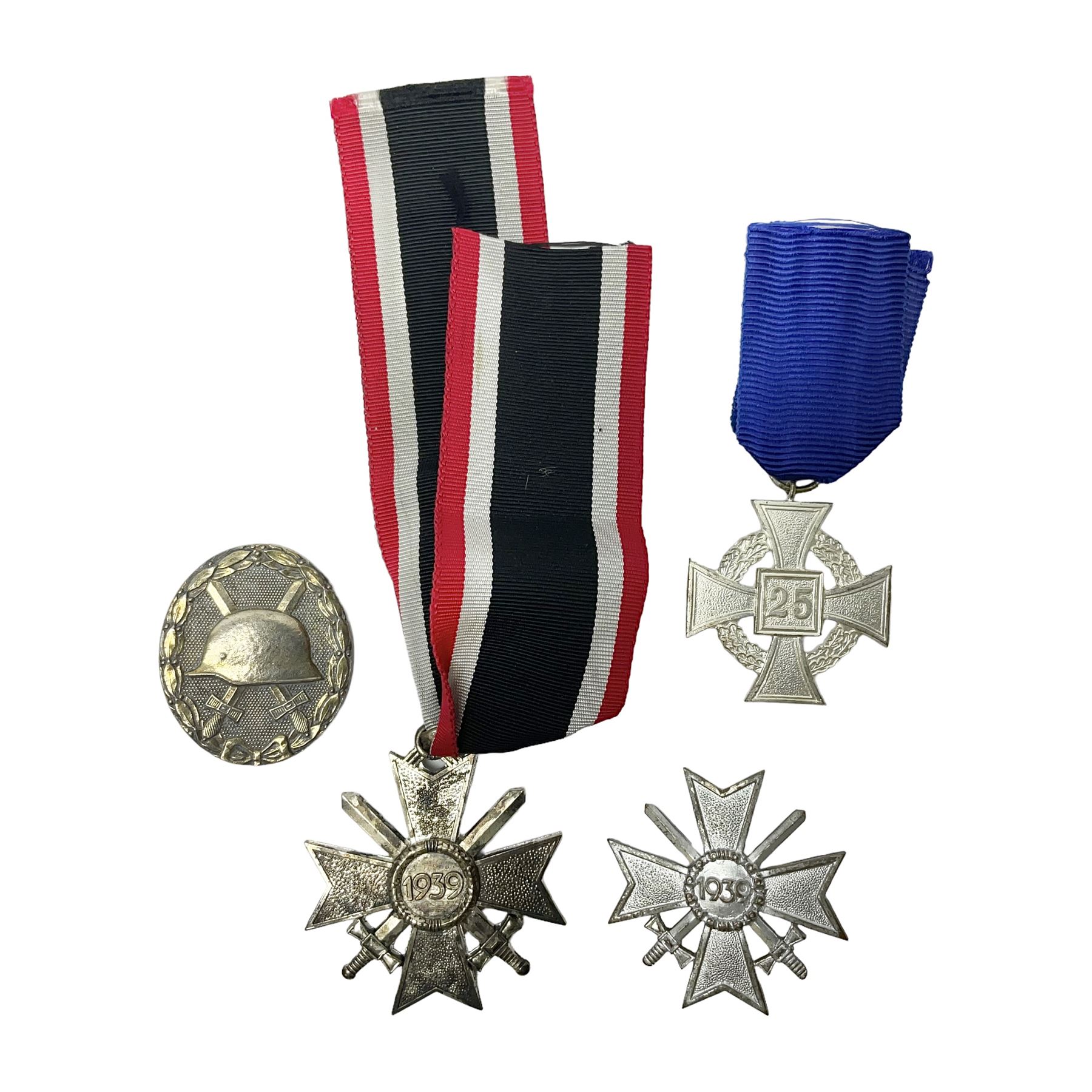 Four German awards c1957 - Knights Cross of the War Merit Cross, War Merit Cross 1st Class, Faithful Service Cross and Silver Wound badge (4)