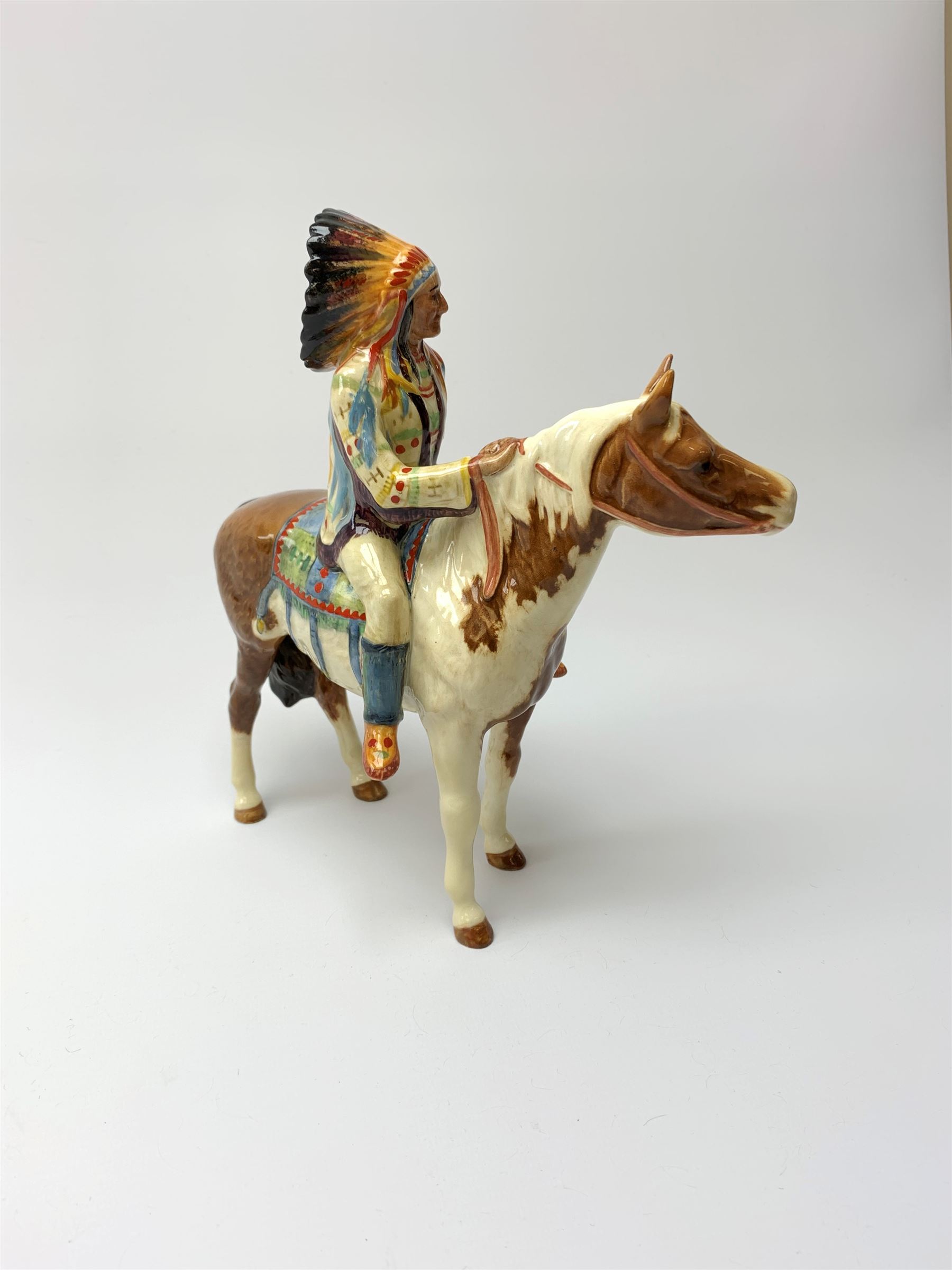 A Beswick Native American on horseback, with printed mark beneath, H21.5cm. 