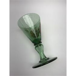 19th century bohemian green glass wine glass, the funnel bowl decorated in enamells with a Historismus hunting scene in the manner of Egermann & Lobmeyr, upon a baluster stem and circular foot, H14.5cm