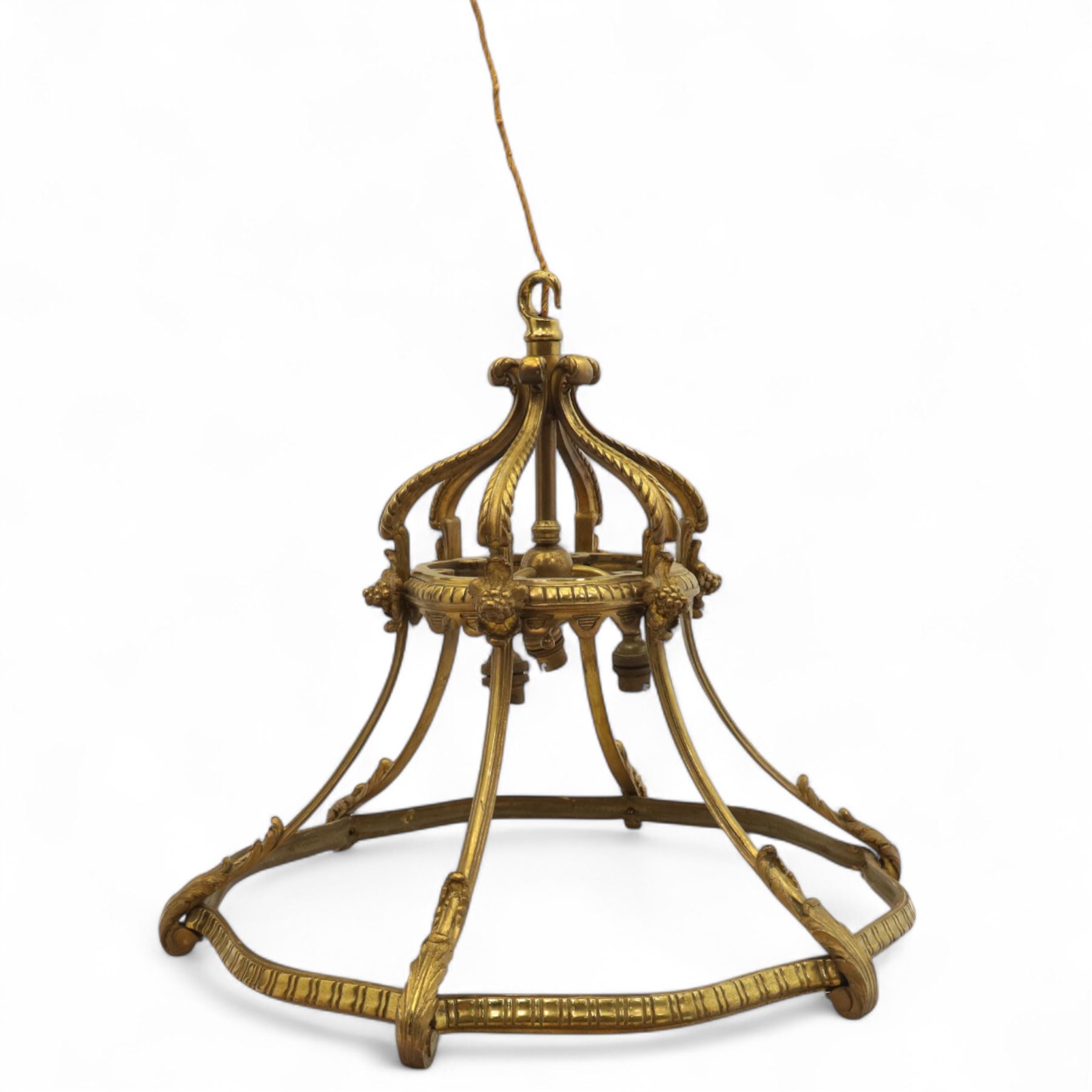 Late Victorian gilt bronze neoclassical style open chandelier, open crown form suspended chandelier with hook finial and downward sweeping reeded and scrolled arms forming a canopy with six acanthus decorated ribs, lower section outward curved ribs forming a circular hoop detailed with fluted ornament and small foliate clasps, wired for electricity 