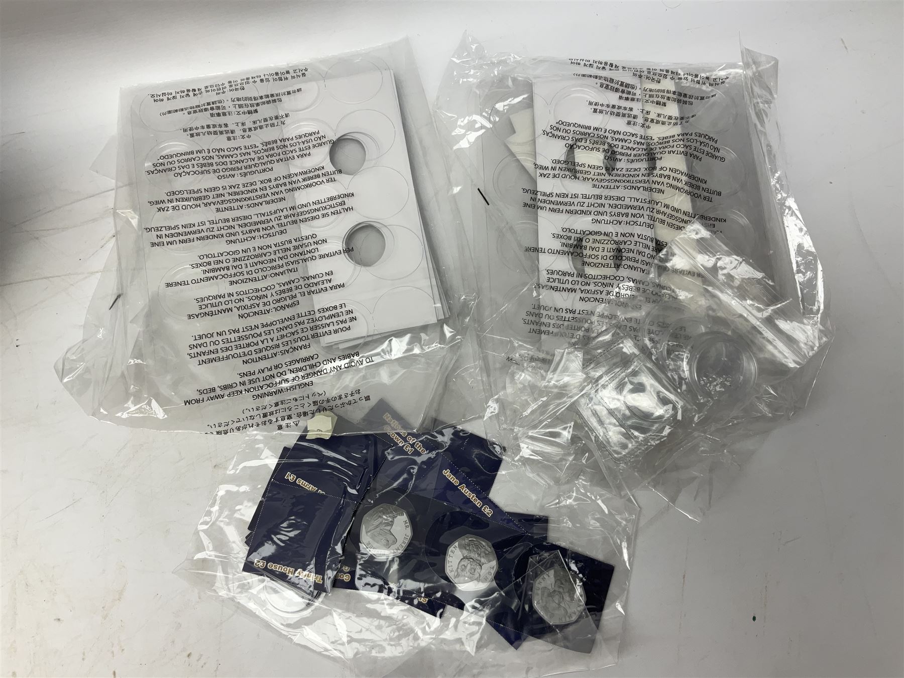 Great British and World coins, including two The Royal Mint Experience 2018 Sir Isaac Newton fifty pence coins on cards, commemorative crowns, Queen Elizabeth II 1999 five pounds, pre-decimal coinage, various Isle of Man fifty pence pieces etc