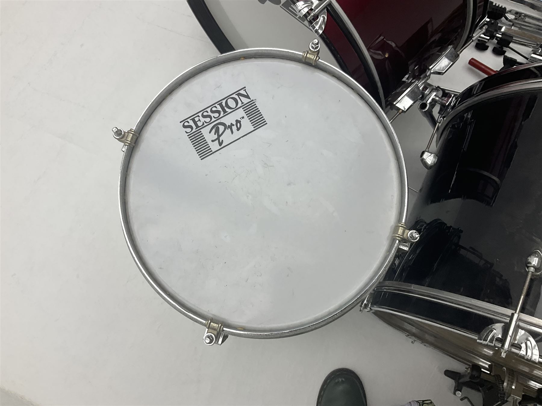 Rockburn eight-piece black drum kit with bass drum, floor tom and five other toms and snare drum; together with two other snare drums; Haosen bass drum; four cymbals; various stands, foot pedals, stool, tri-angle, drum sticks etc