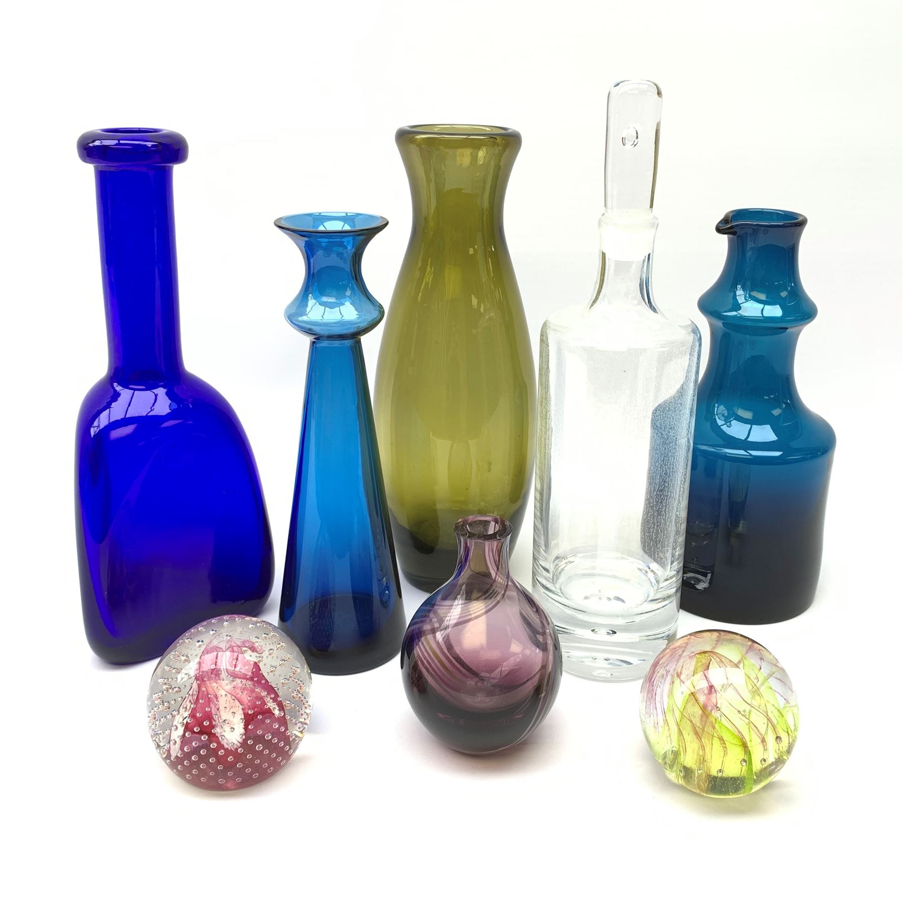 Kosta Boda decanter bottle, c1960, designed by Erik Höglund (1932-1998), in a triangular pressed form, engraved pattern number H1250/250, a clear glass decanter with bubble inclusion, probably Kosta Boda, two Scandinavian glass vases, ochra glass vase, Isle of Wight glass paperweight, Caithness glass paperweight & vase (8)