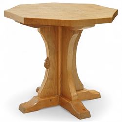 Mouseman - octagonal occasional table, raised on a cruciform base with arched supports, carved with signature mouse to one side, by the workshop of Robert Thompson, Kilburn